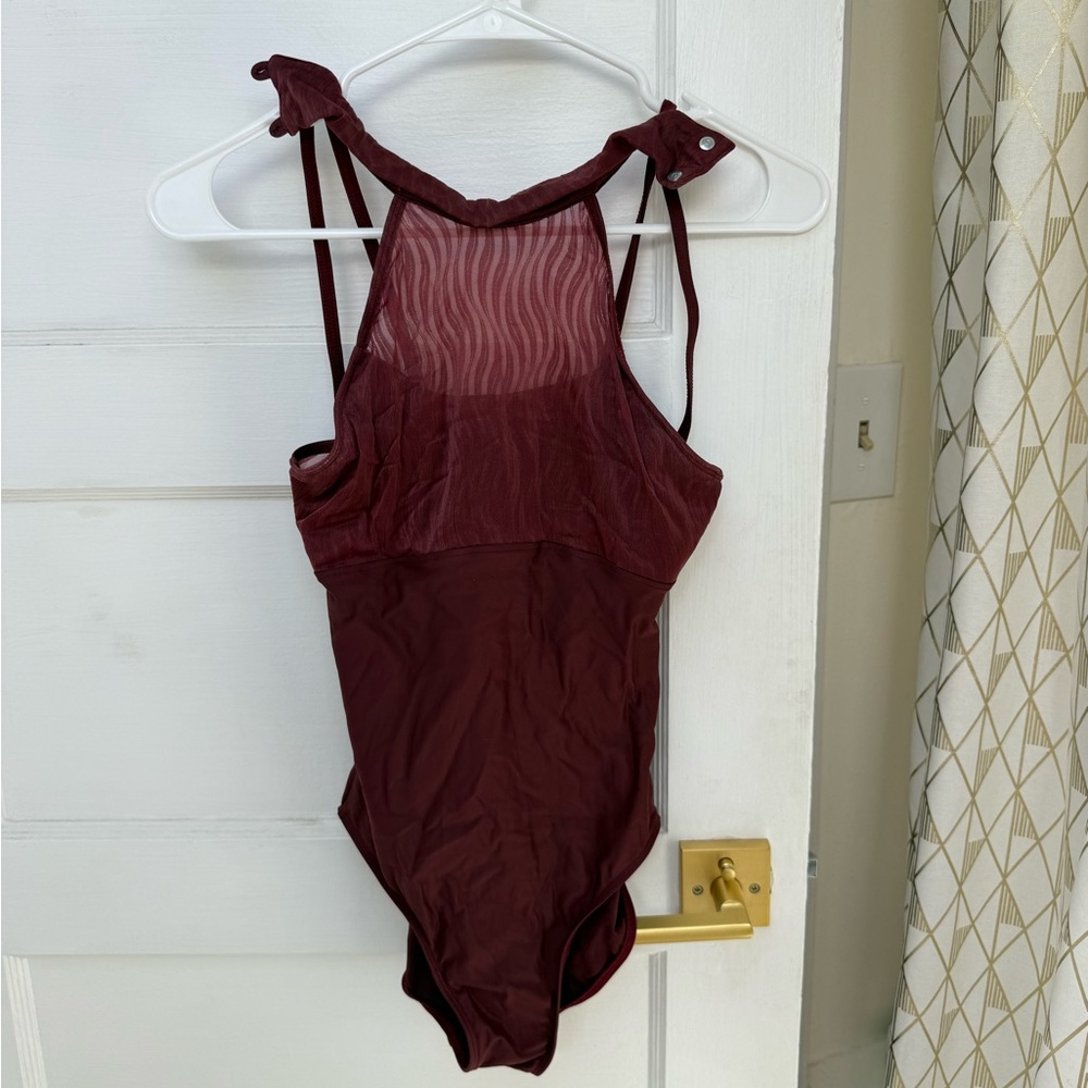 2 Wear Moi leotards in black and maroon.